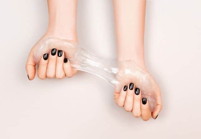 hands holding slime